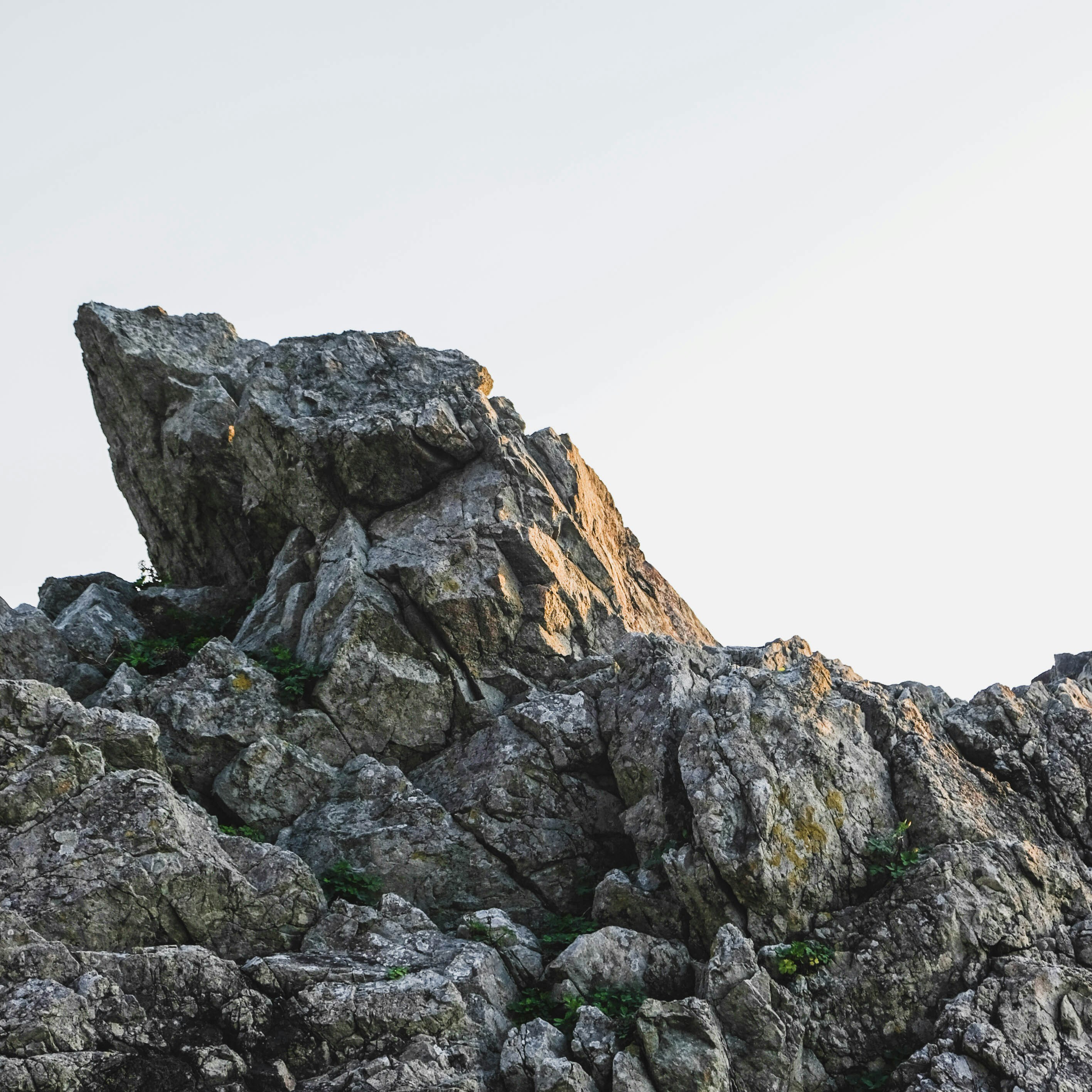 gray rocky mountain under white sky during daytime